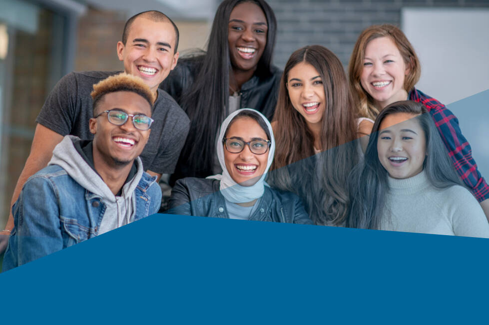 Seven young adults smiling